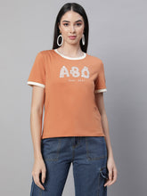 women orange round neck embellished top